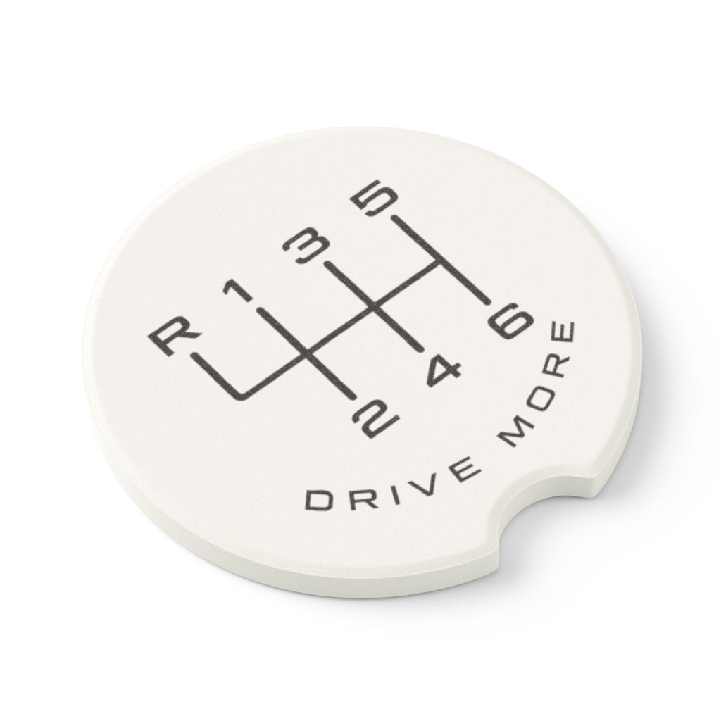 Angled view of absorbent soapstone car coaster with manual transmission shift pattern