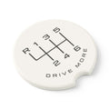 Angled view of absorbent soapstone car coaster with manual transmission shift pattern