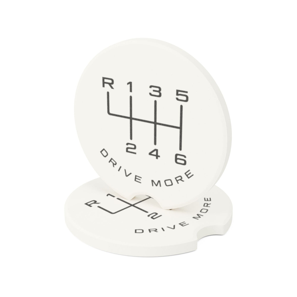 Pair of soapstone car coasters with 6-speed manual shift pattern and Drive More design