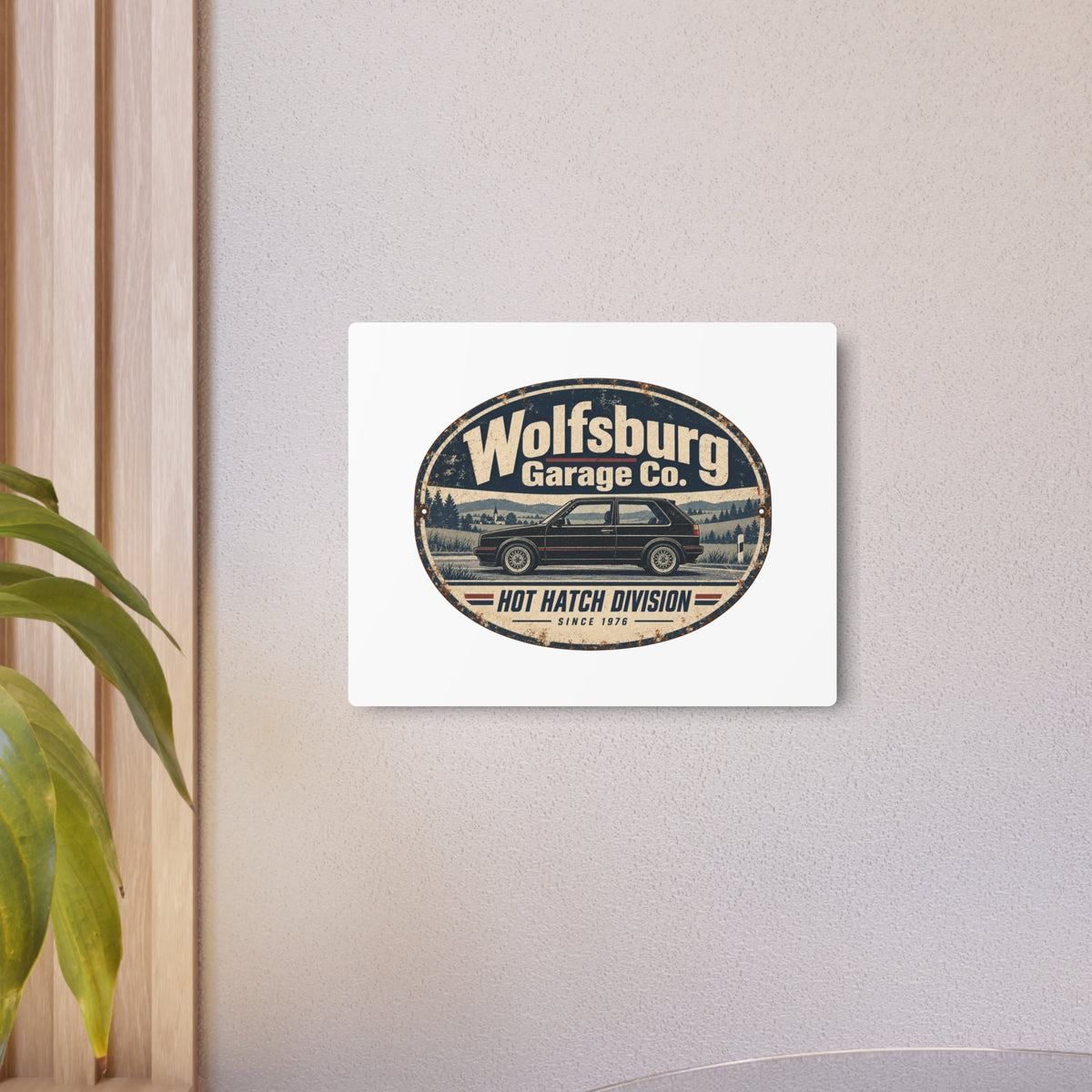 Wolfsburg Garage Co. metal sign displayed on a wall in a modern room
