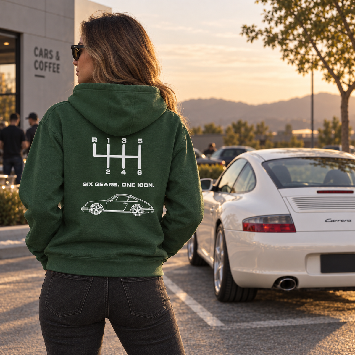 Woman wearing green Six Gears One Icon manual transmission hoodie outdoors, rear view