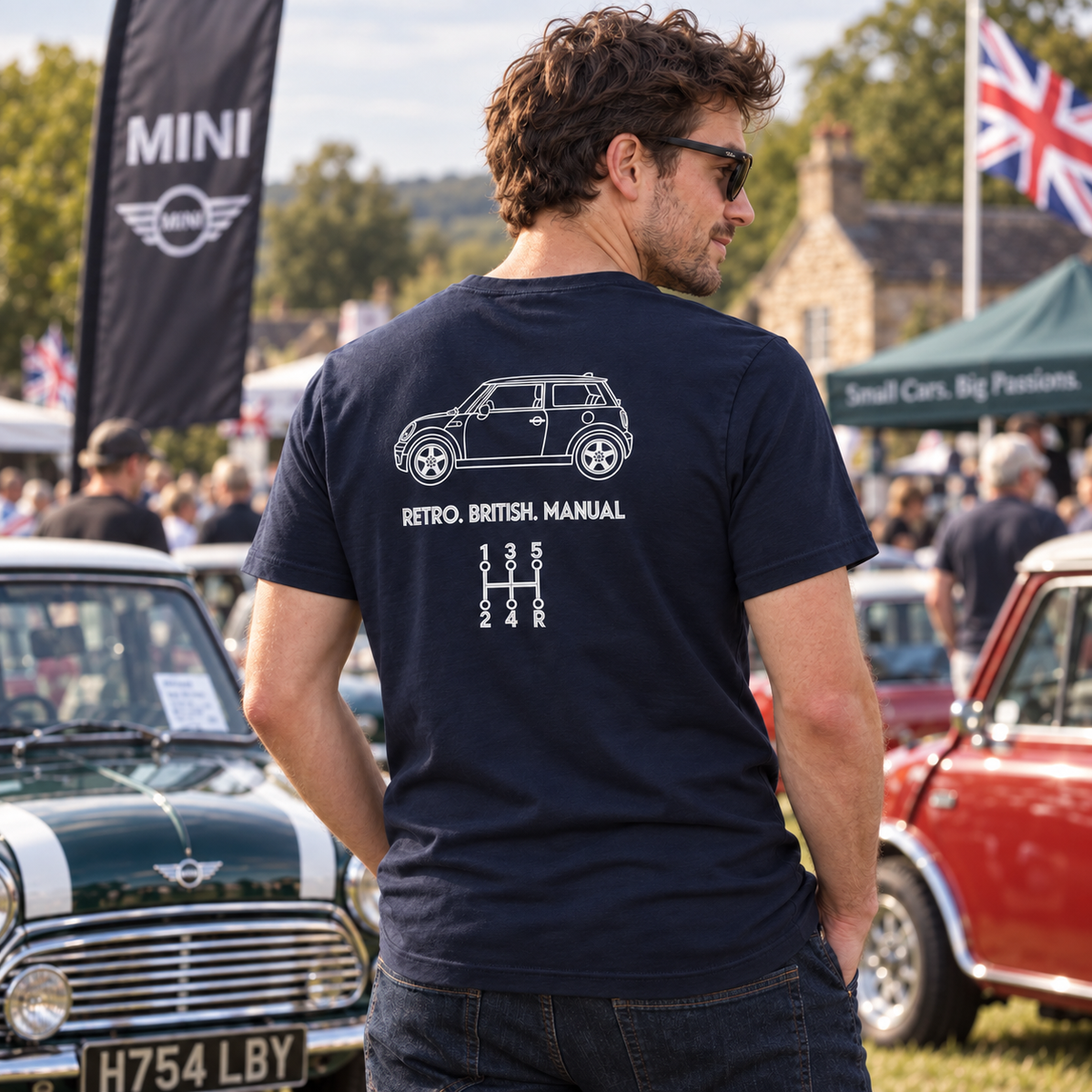 Man wearing navy Mini Cooper manual transmission T-shirt at a classic British car gathering