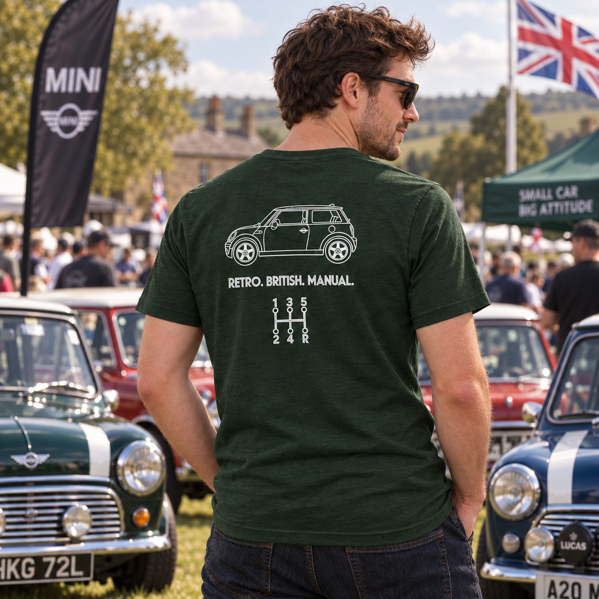 Man wearing green Mini Cooper manual transmission T-shirt at a classic car show