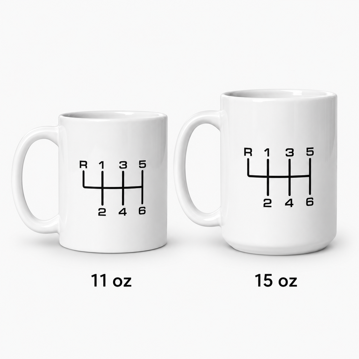 11 oz and 15 oz manual transmission mugs side by side for size comparison