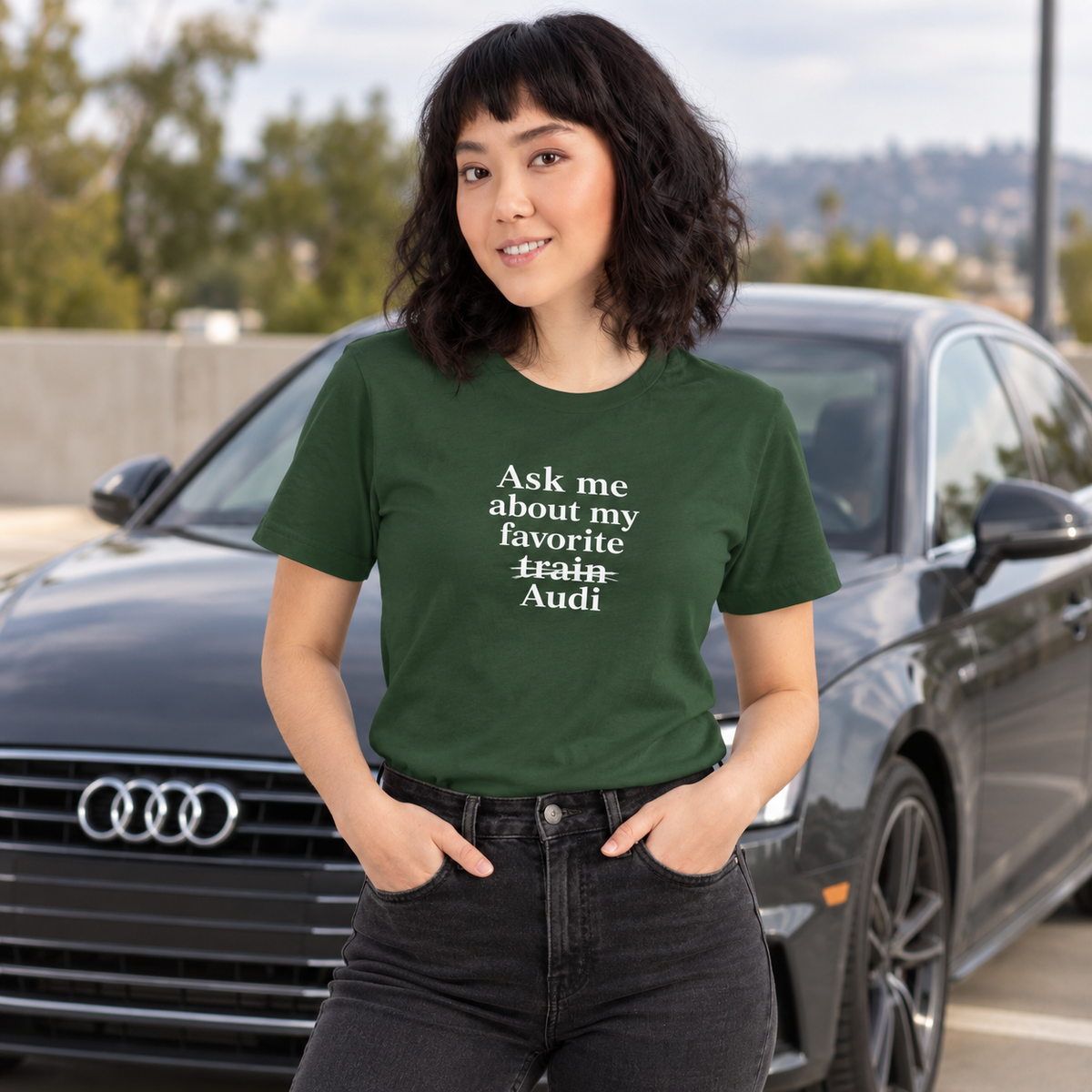 Woman wearing green Audi front-print T-shirt outdoors