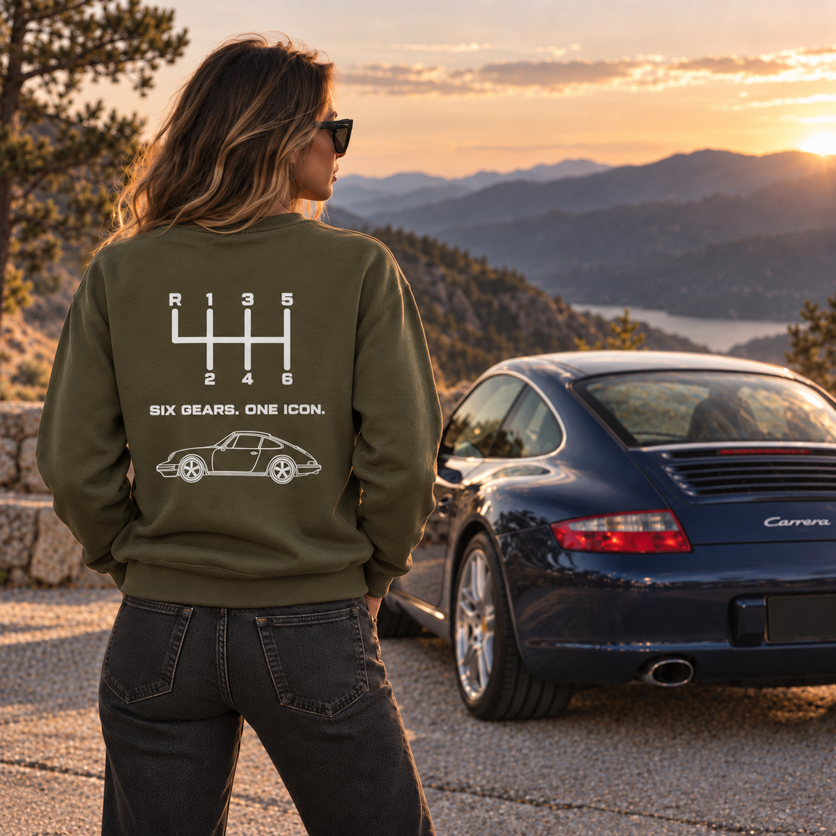 Woman wearing green manual transmission hoodie at sunset, showing Six Gears One Icon back print