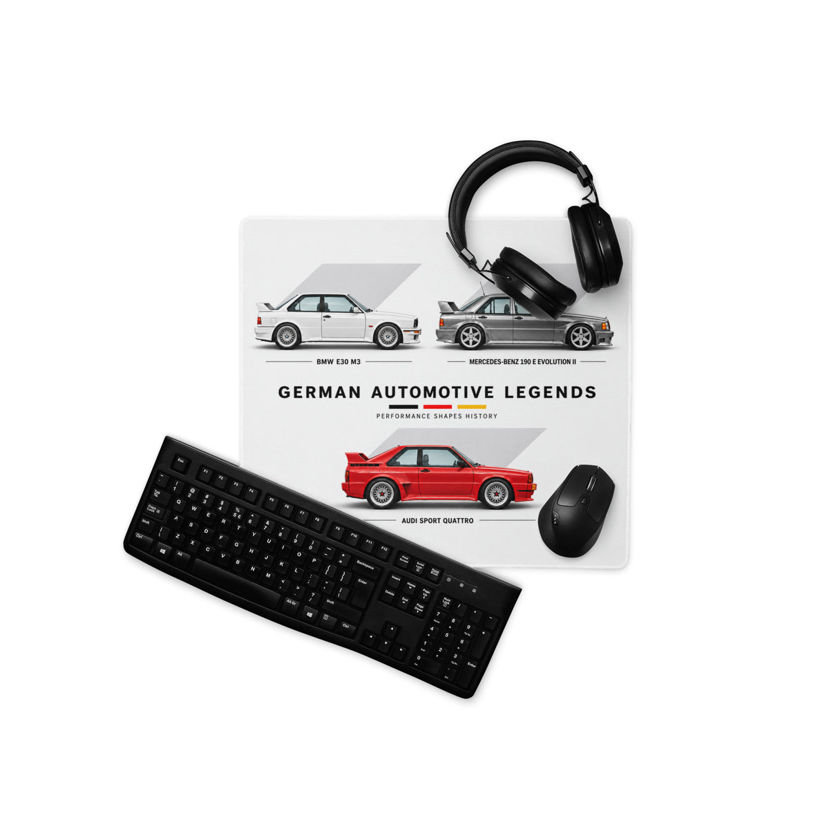 Automotive gaming mouse pad with BMW E30 M3, Mercedes 190E Evo II and Audi Sport Quattro beside keyboard and mouse