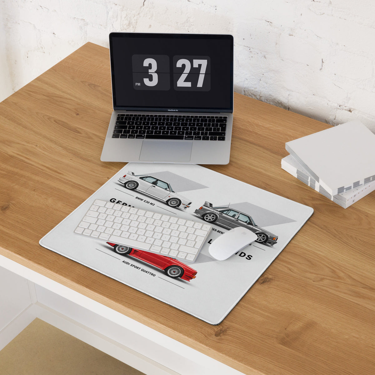 German automotive mouse pad on light wood desk with E30 M3, 190E Evo II and Audi Sport Quattro design