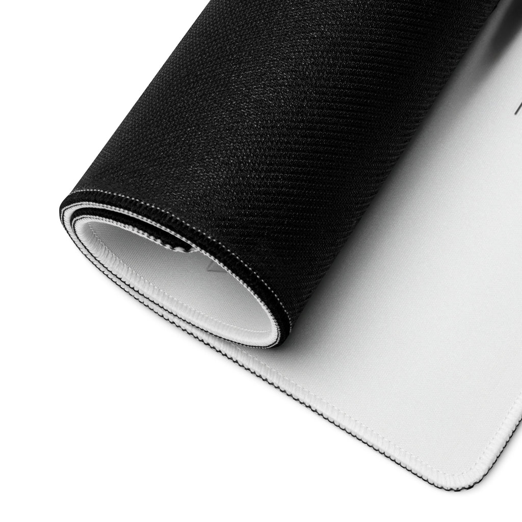 Rolled gaming mouse pad showing flexible construction and black backing