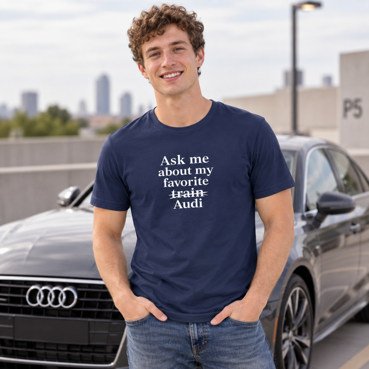 Man wearing blue Audi front-print T-shirt outdoors