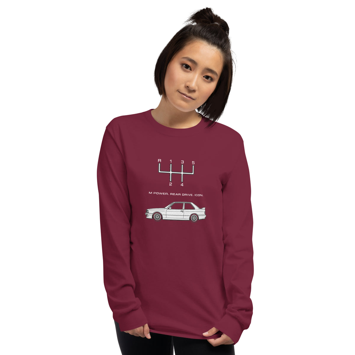 Woman wearing maroon E30 M3 long sleeve T-shirt with 5-speed manual transmission and classic car graphic.