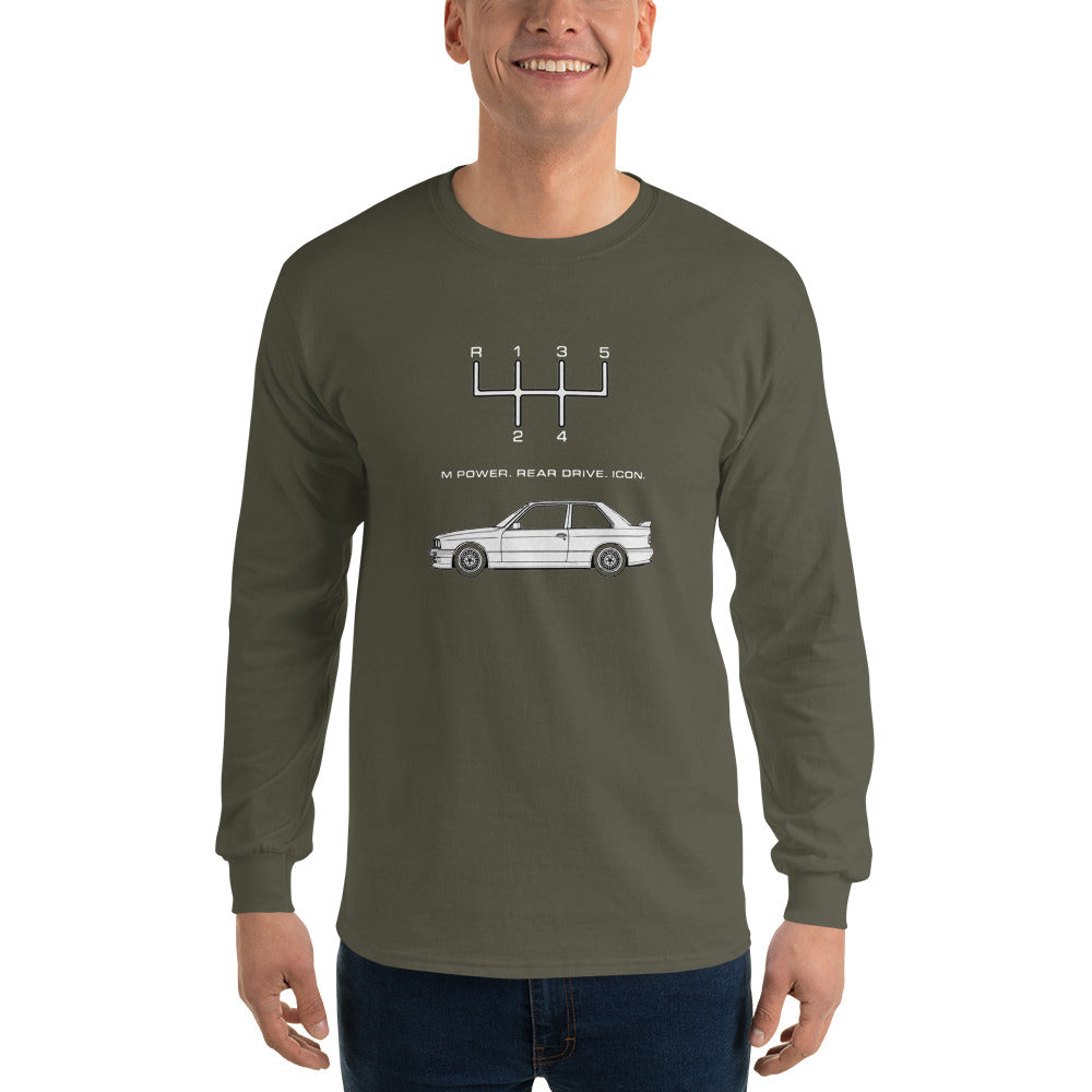 Man wearing military green E30 M3 long sleeve enthusiast shirt with 5-speed shift pattern and car graphic.