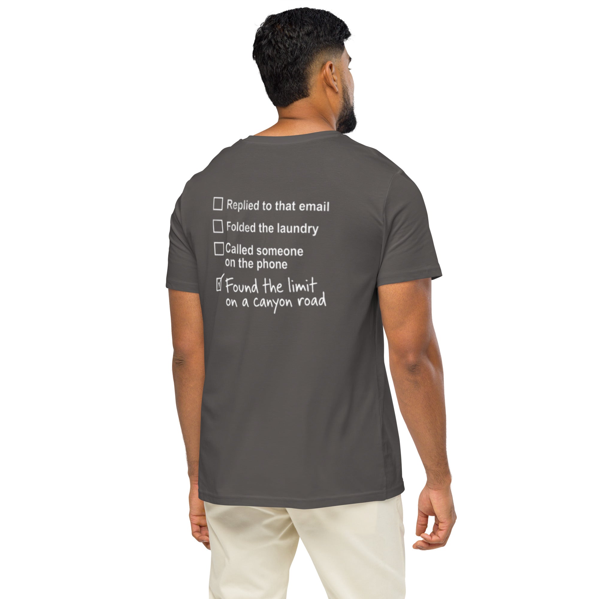 Model wearing anthracite canyon road driving T-shirt showing checklist graphic on the back