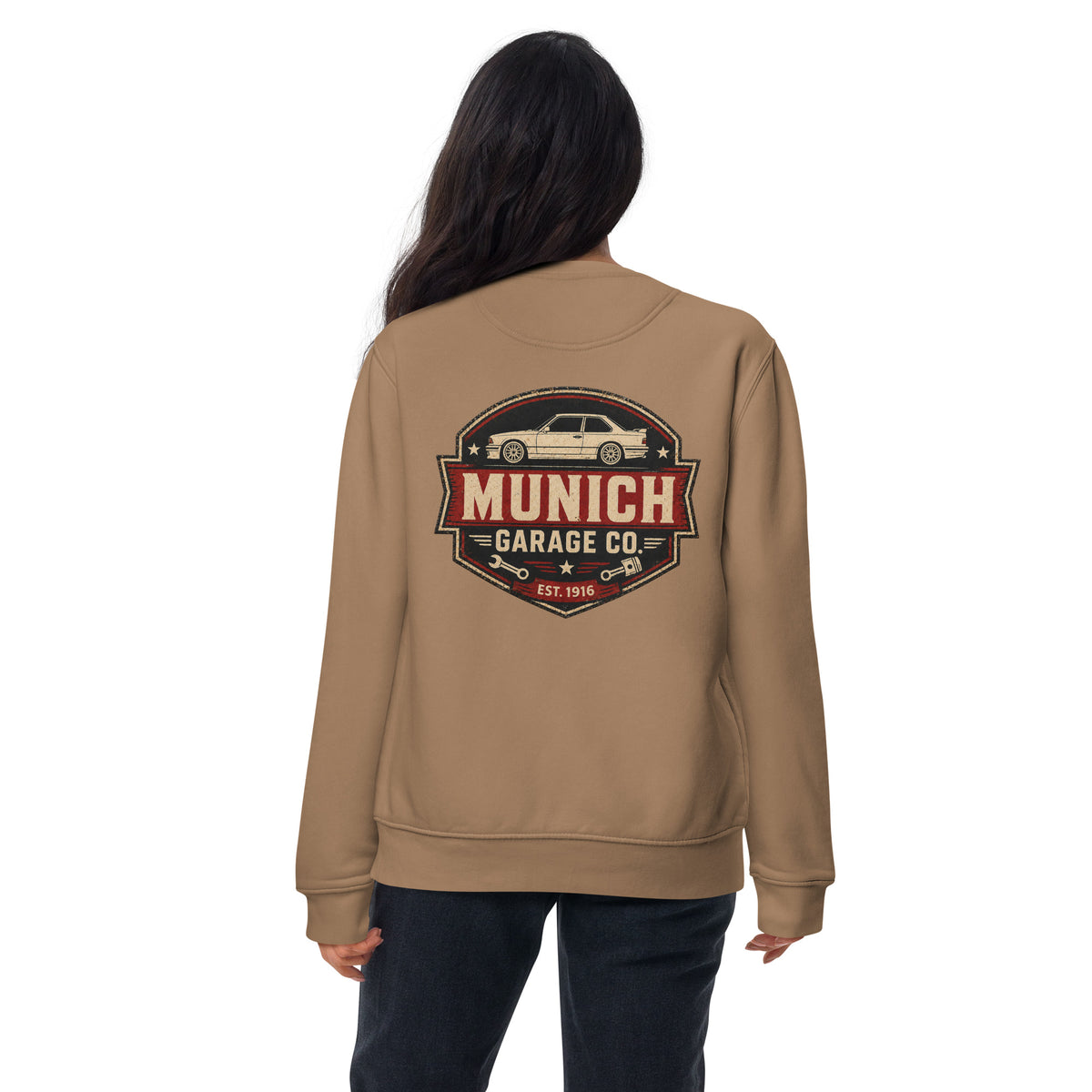 Woman modeling Munich Garage Co. unisex BMW sweatshirt showing the vintage back graphic