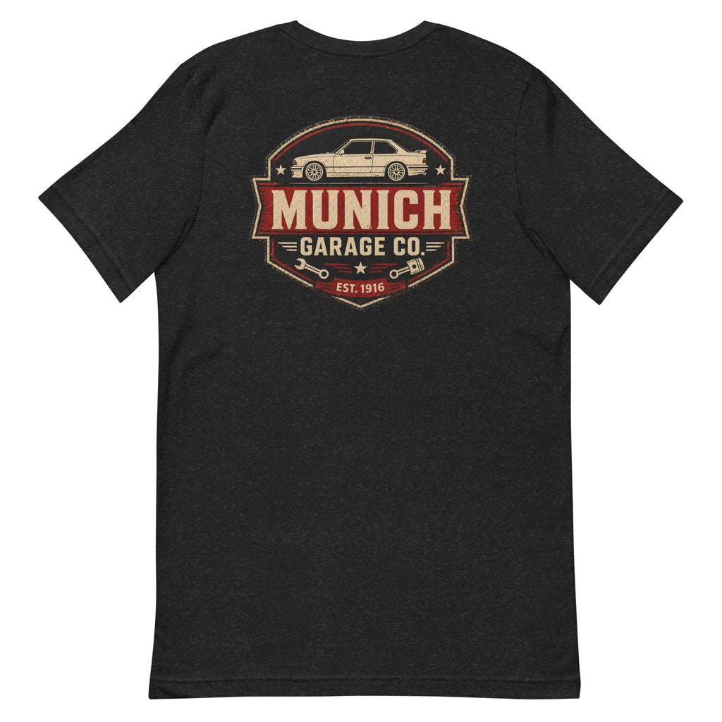 Back-view flat lay of black heather Munich Garage Co. T-shirt with large vintage-inspired rear print.