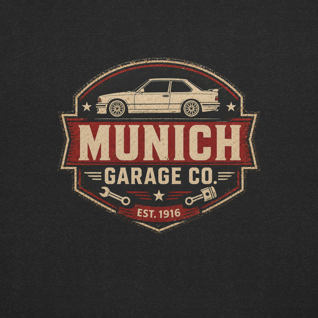 Close-up of the Munich Garage Co. rear-print graphic featuring a vintage BMW coupe, distressed lettering, and workshop-inspired emblem details.