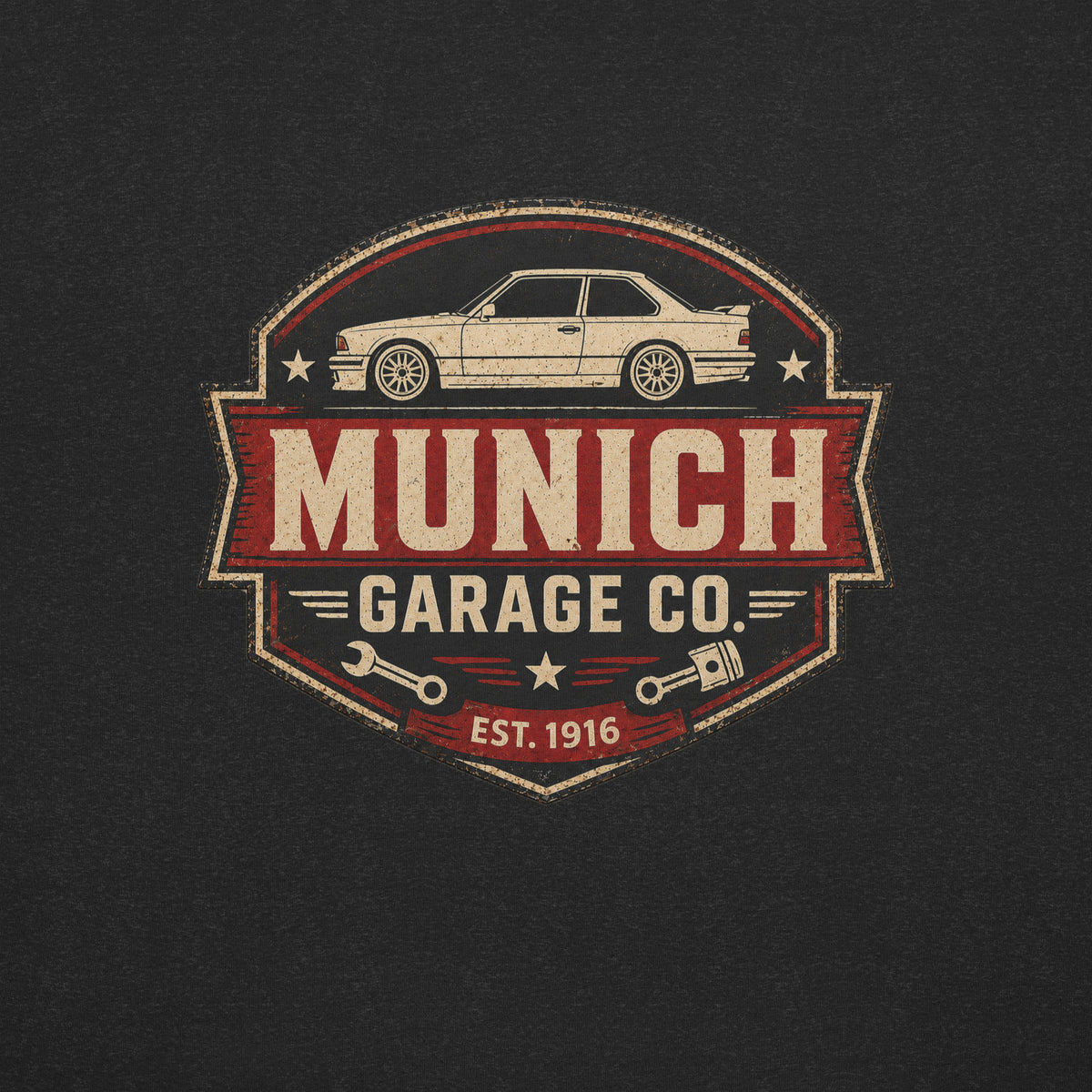 Close-up of the Munich Garage Co. rear-print graphic featuring a vintage BMW coupe, distressed lettering, and workshop-inspired emblem details.