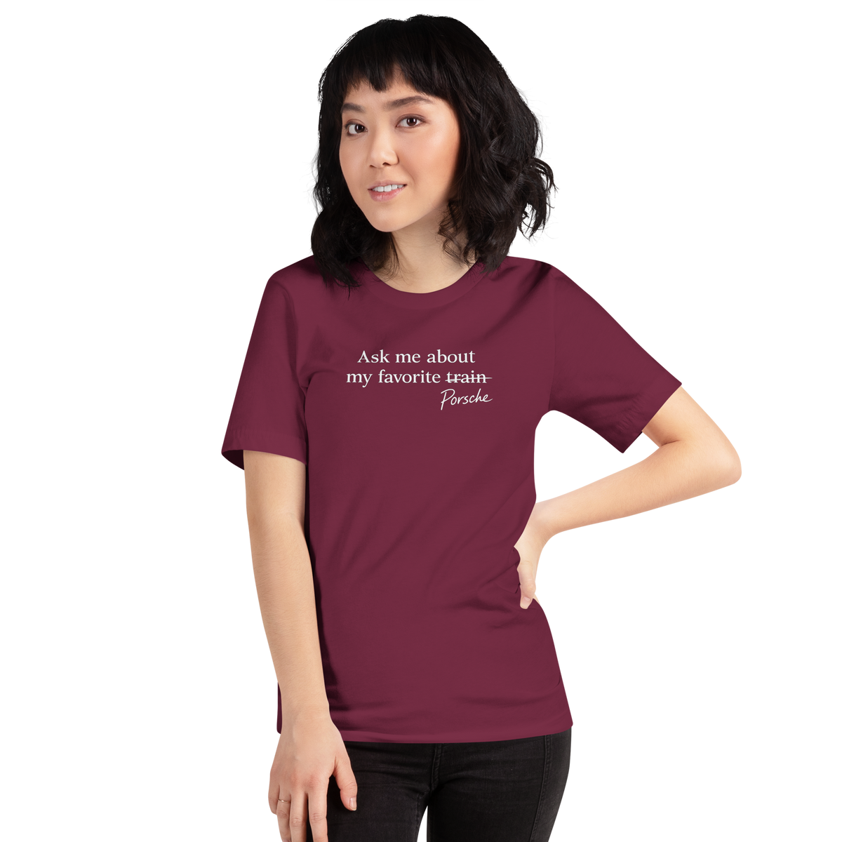 Woman wearing maroon Bella + Canvas 3001 Porsche humor T-shirt with front graphic