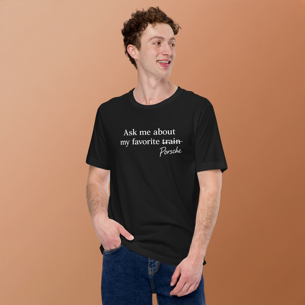 Model wearing black Porsches Not Trains Porsche humor T-shirt with white front graphic