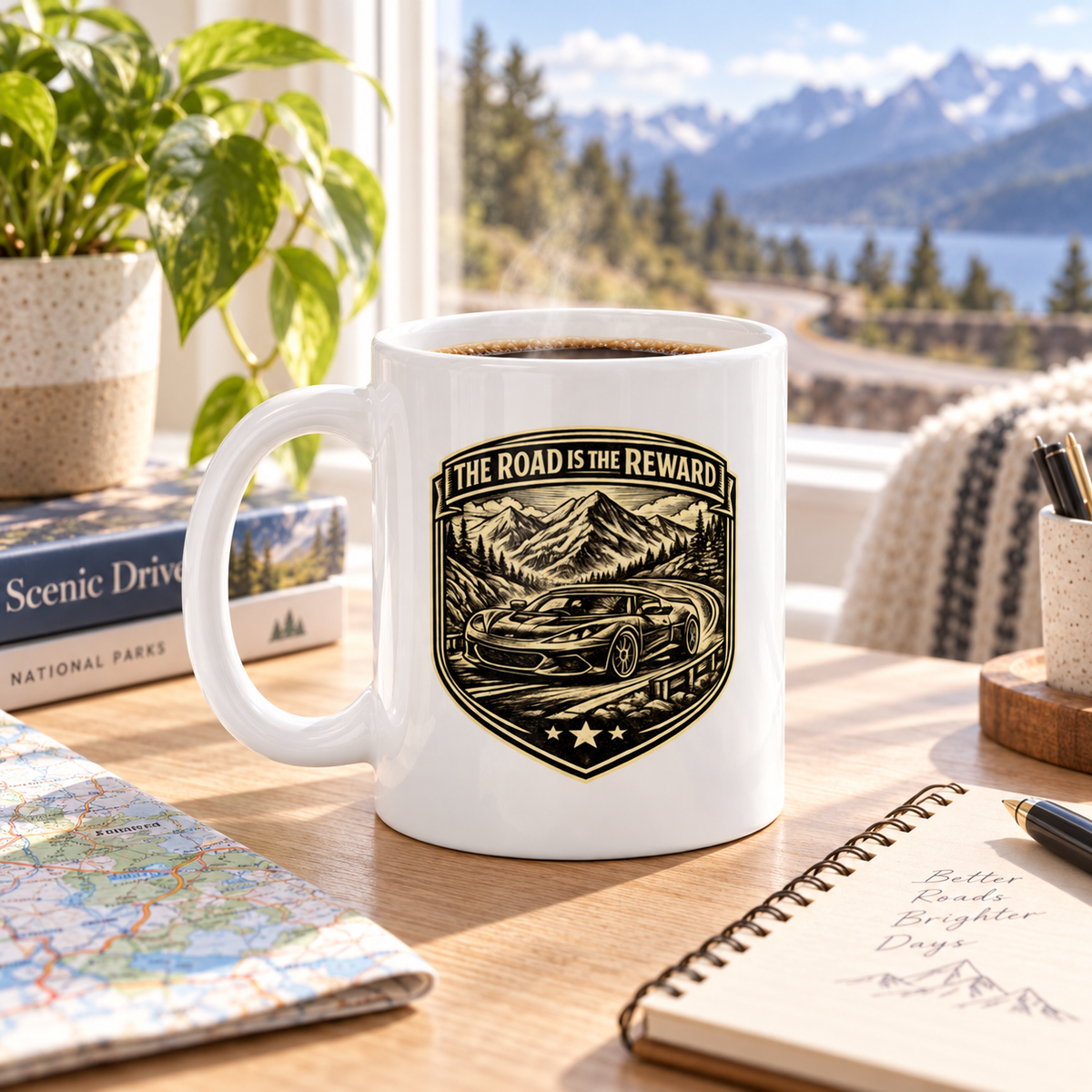 White vintage automotive mug with sports car badge artwork on a sunlit tabletop with scenic road trip styling