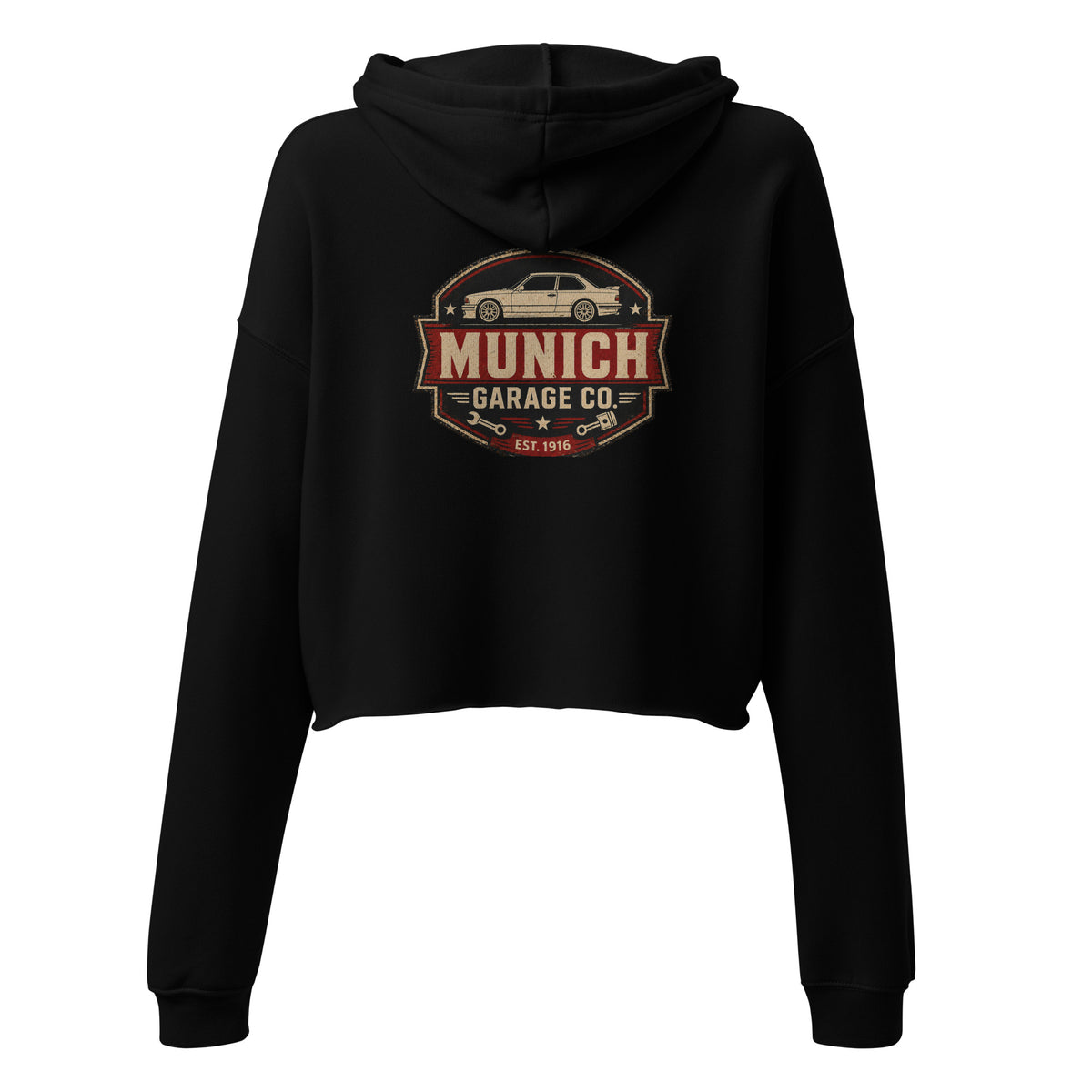 Back view of black Munich Garage Co. women’s cropped hoodie showing the vintage automotive graphic.